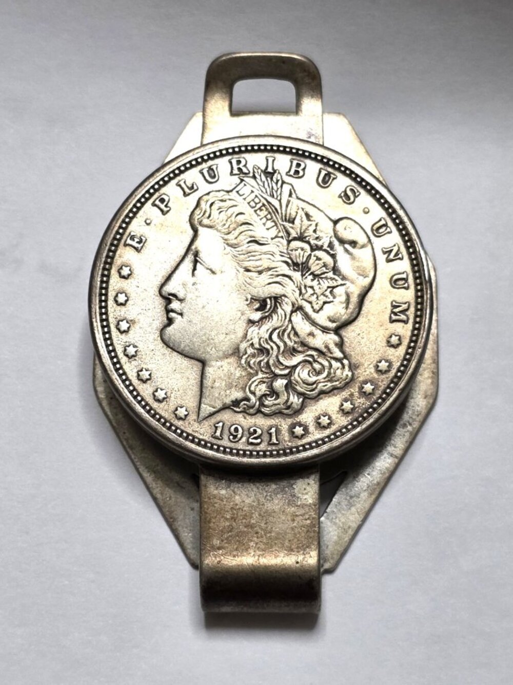 1921    Silver Dollar in a money clip Coin is in excellent condition rated EF43